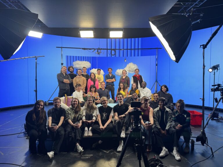 Sunday Treat crew and client team on a studio set between takes