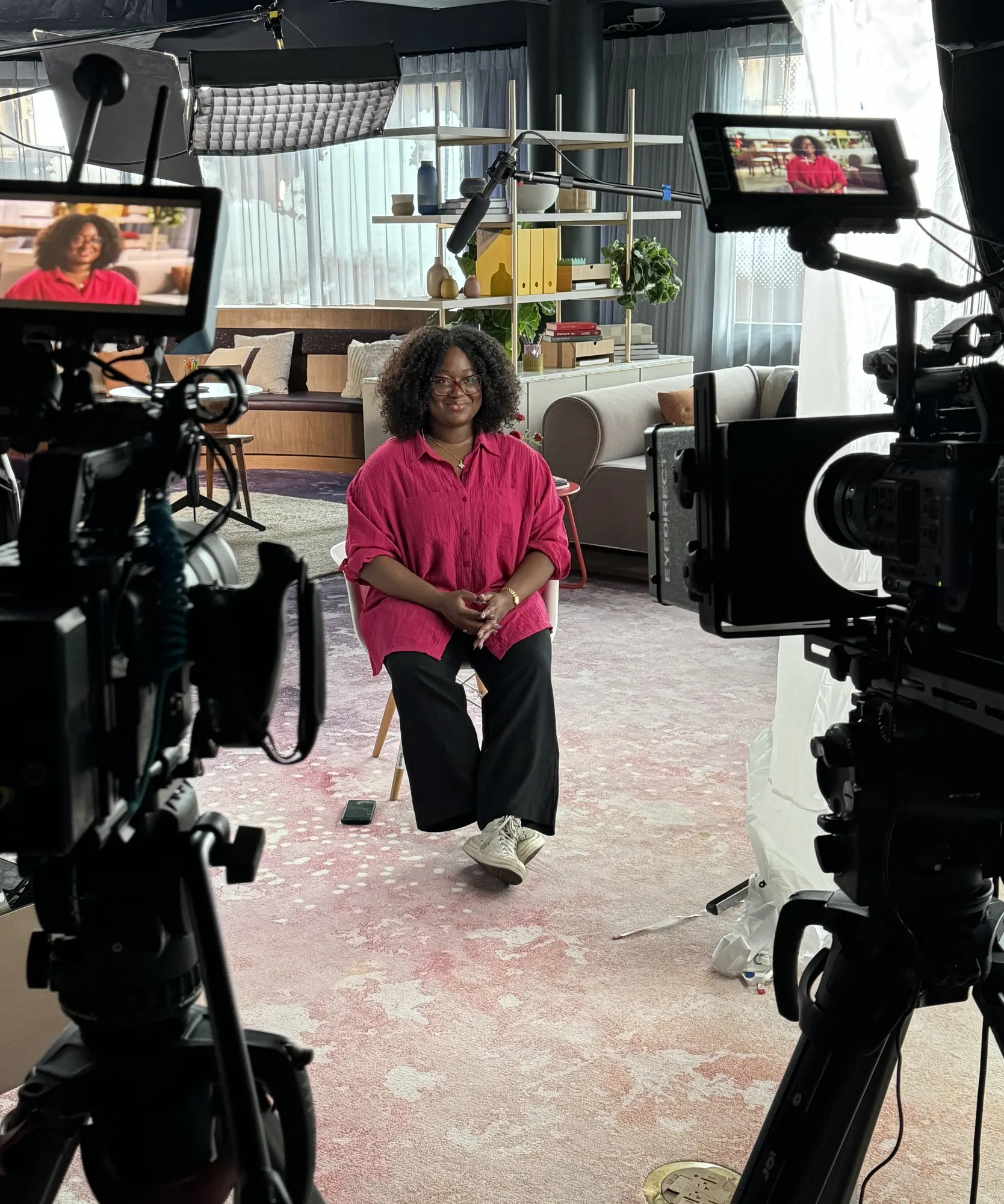 Presenter being filmed creating short-form vertical video content