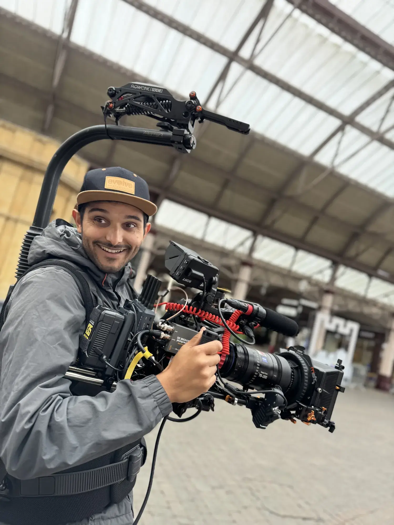 A Sunday Treat camera operator filming handheld content with a gimbal-mounted rig